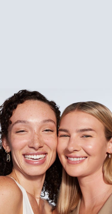 Two female JUVÉDERM patients posing.